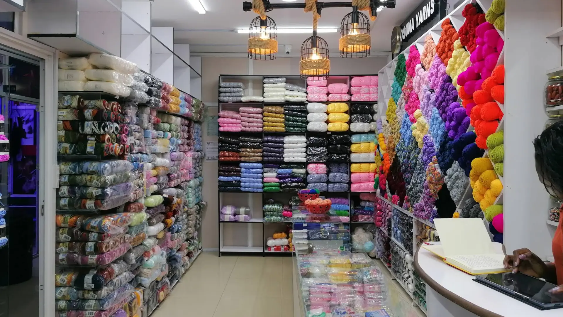 Inside the Osona Yarns shop: shelves of yarn in every colour
